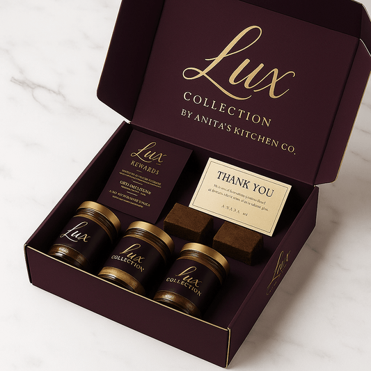 Lux Collection gift box by Anita's Kitchen Co., featuring jars of desserts and thank you card on marble surface